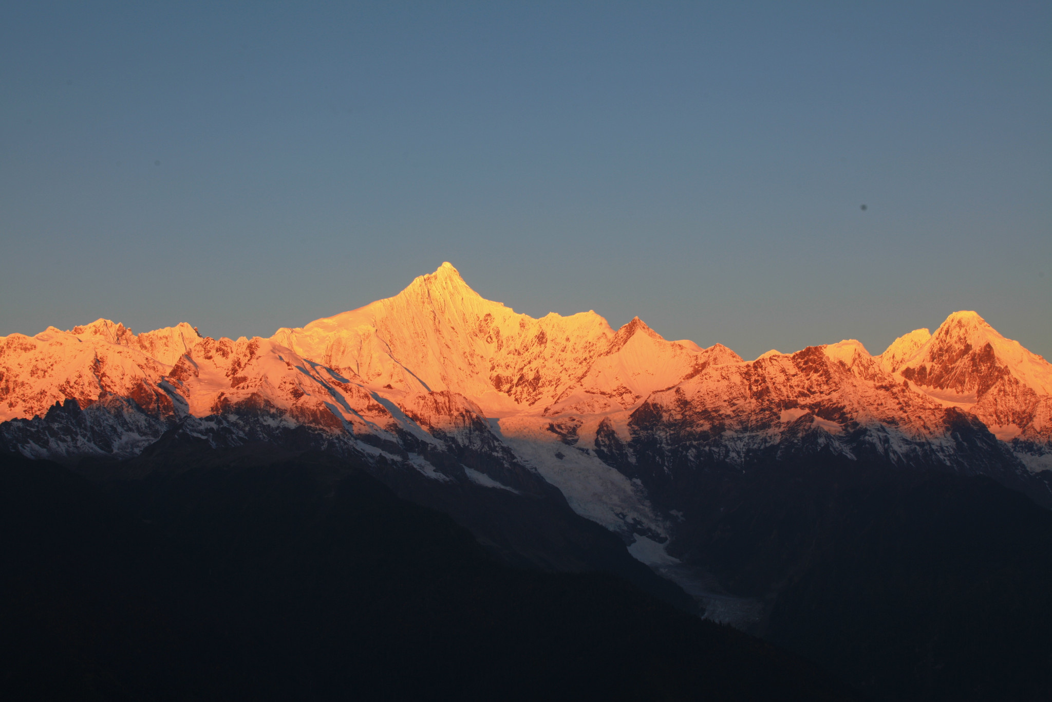 Meili Snow Mountain at golden sunrise, the summit of Kawagebo gilded in light