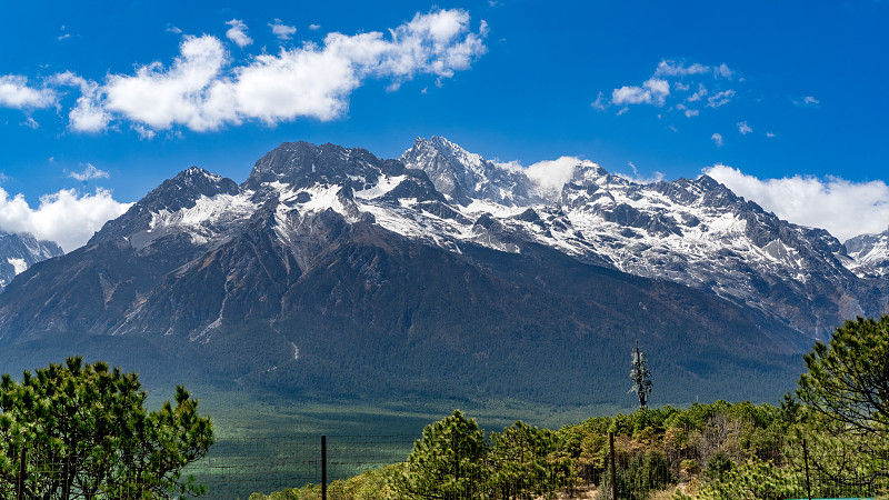 Jade Dragon Snow Mountain, its main peak rising above pine forests and meadows